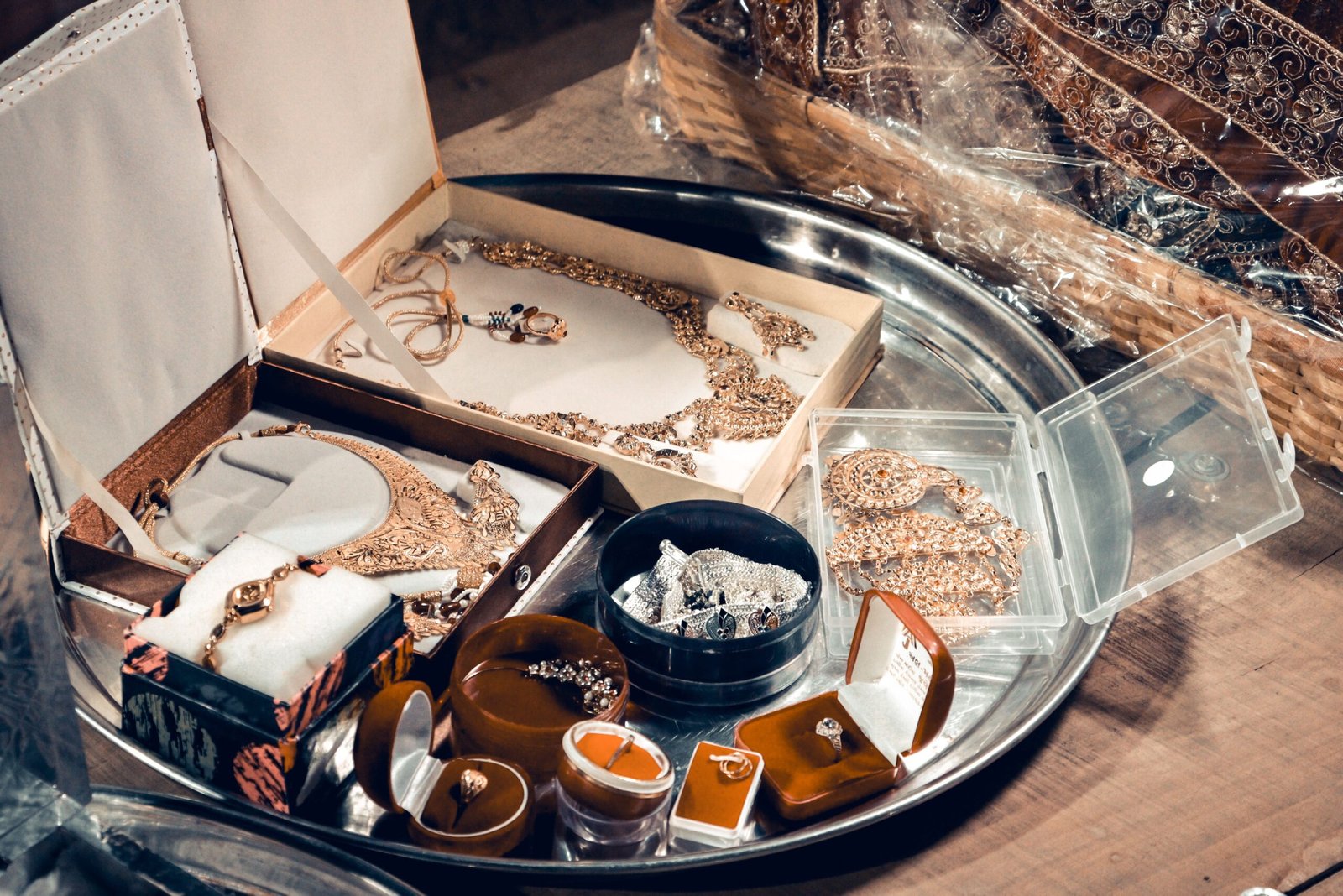 A collection of traditional Indian bridal jewelry featuring necklaces, bangles, and rings in a beautiful display.